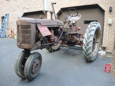 1950 Farmall C with 7' cycle bar mower, 2-bottom plow, and disc