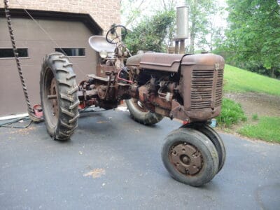 1950 Farmall C with 7' cycle bar mower, 2-bottom plow, and disc
