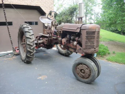 1950 Farmall C with 7' cycle bar mower, 2-bottom plow, and disc